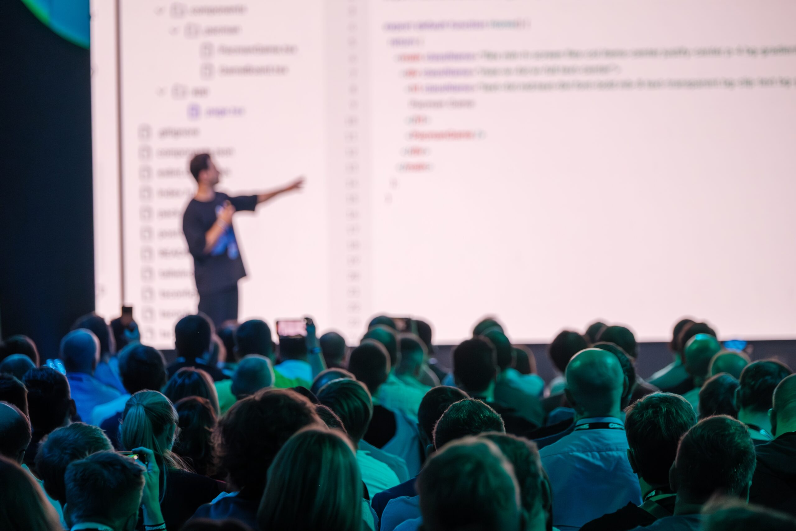 Engaging,Conference,With,Speaker,Presenting,Programming,Concepts,To,Audience.,Large